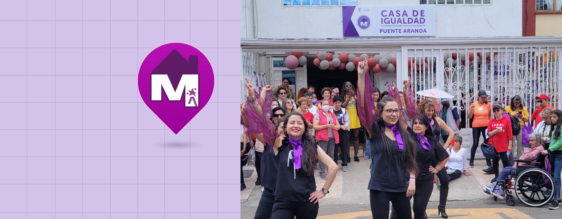 Grupo de danza de mujeres frente a una CIOM realizando presentación